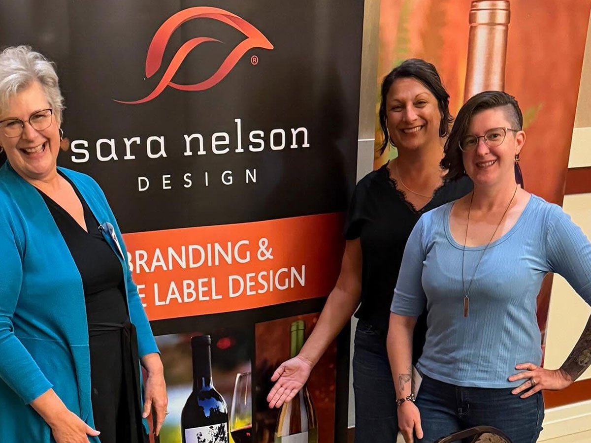 picture of Sara and two attendees at the WAWGG Conference Trade Show