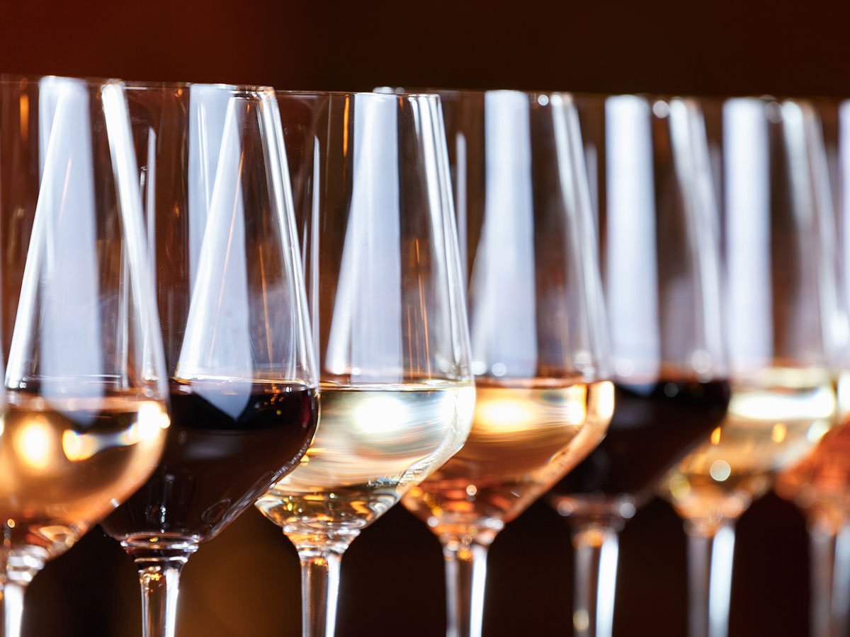 Picture of wine glasses with alternating Rose', Red & White wines.