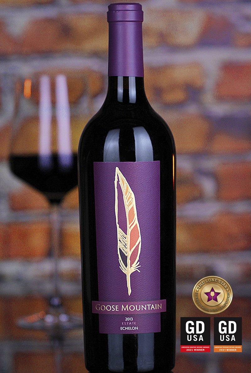 Goose Mountain wine label with a goose feather turned on its side to form a mountain silhouette
